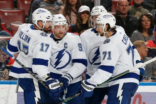 Teammates congratulate Alex Killorn of the Tampa Bay Lightning after he scored a second period goal against the Florida Panthers during a preseason...