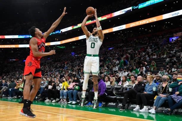 Jayson Tatum of the Boston Celtics shoots a three point basket during a preseason game against the Toronto Raptors on October 9, 2021 at the TD...