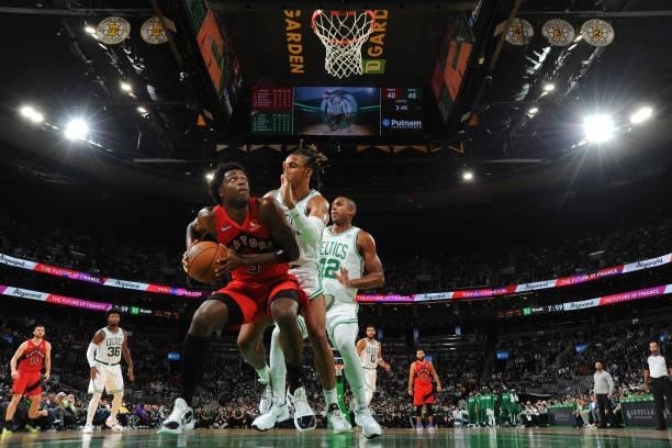Anunoby of the Toronto Raptors drives to the basket during a preseason game against the Boston Celtics on October 9, 2021 at the TD Garden in Boston,...