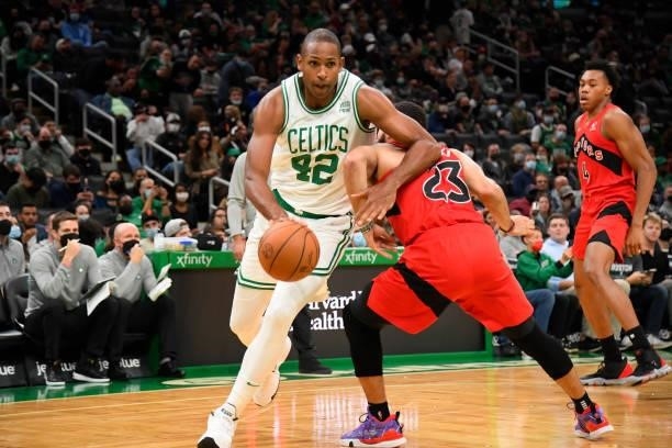 Al Horford of the Boston Celtics drives to the basket during a preseason game against the Toronto Raptors on October 9, 2021 at the TD Garden in...