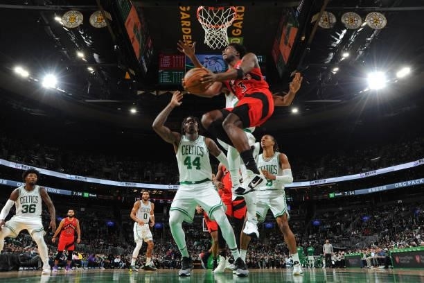 Anunoby of the Toronto Raptors drives to the basket during a preseason game against the Boston Celtics on October 9, 2021 at the TD Garden in Boston,...