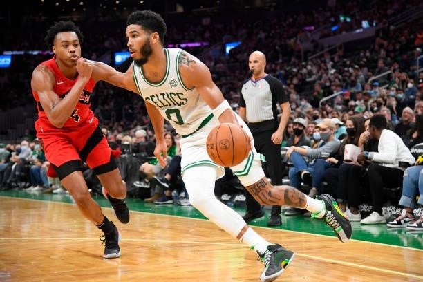 Jayson Tatum of the Boston Celtics drives to the basket during a preseason game against the Toronto Raptors on October 9, 2021 at the TD Garden in...