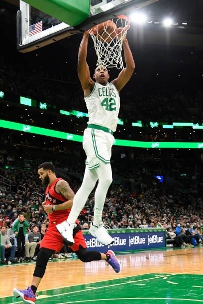 Al Horford of the Boston Celtics dunks the ball during a preseason game against the Toronto Raptors on October 9, 2021 at the TD Garden in Boston,...