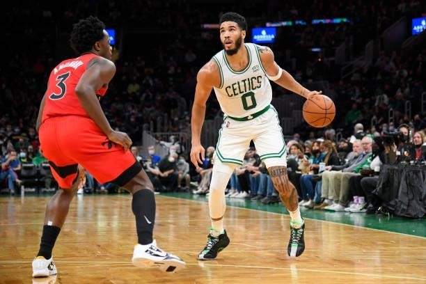 Jayson Tatum of the Boston Celtics handles the ball during a preseason game against the Toronto Raptors on October 9, 2021 at the TD Garden in...