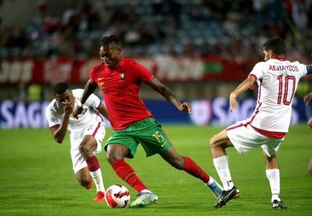 Rafael Leao of Portugal competes for the ball with Abdulaziz Hatem and Hassan Al-Haydos of Qatar during the international friendly match between...