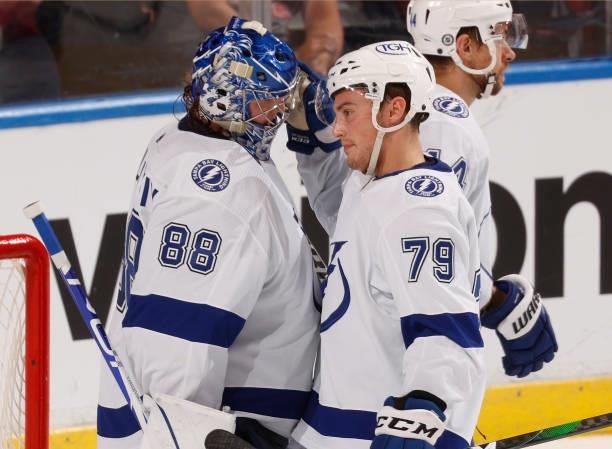 Goaltender Andrei Vasilevskiy is congratulated by Ross Colton of the Tampa Bay Lightning after the game against the Florida Panthers at the FLA Live...