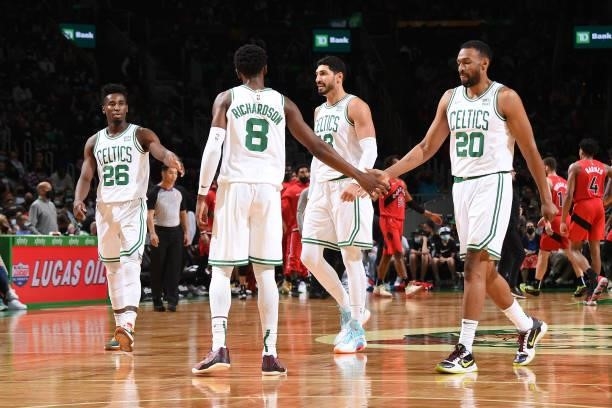 Josh Richardson of the Boston Celtics high fives Jabari Parker of the Boston Celtics during a preseason game against the Toronto Raptors on October...