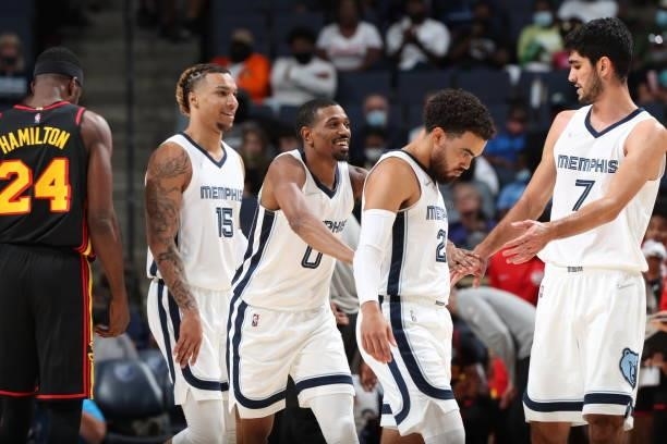 De'Anthony Melton of the Memphis Grizzlies celebrates with teammates during a preseason game against the Atlanta Hawks on October 9, 2021 at...