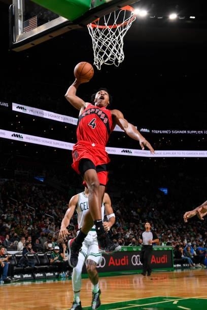 Scottie Barnes of the Toronto Raptors drives to the basket during a preseason game against the Boston Celtics on October 9, 2021 at the TD Garden in...