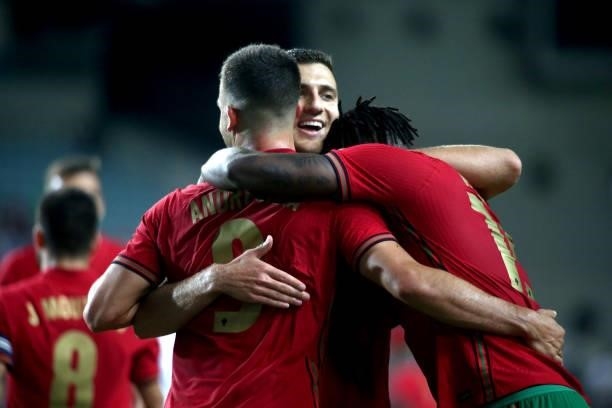 Andre Silva of Portugal celebrates with team mates Rafael Leao and Diogo Dalot after scoring a goal during the international friendly match between...