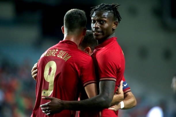 Andre Silva of Portugal celebrates with team mates Rafael Leao after scoring a goal during the international friendly match between Portugal and...