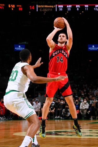 Svi Mykhailiuk of the Toronto Raptors shoots a three point basket during a preseason game against the Boston Celtics on October 9, 2021 at the TD...