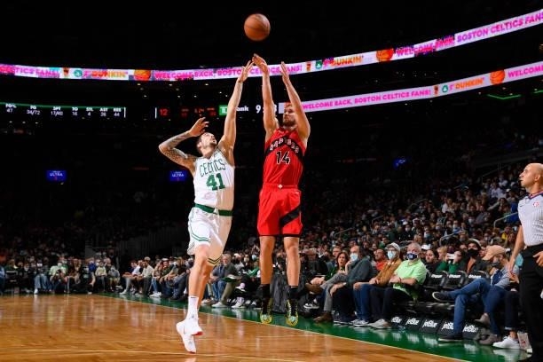 Svi Mykhailiuk of the Toronto Raptors shoots a three point basket during a preseason game against the Boston Celtics on October 9, 2021 at the TD...