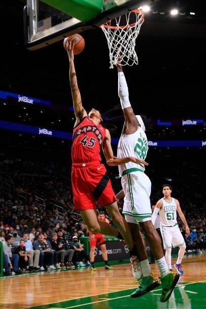 Dalano Banton of the Toronto Raptors drives to the basket during a preseason game against the Boston Celtics on October 9, 2021 at the TD Garden in...