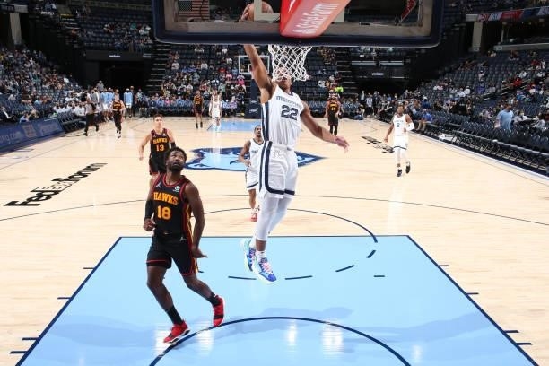 Desmond Bane of the Memphis Grizzlies dunks the ball during a preseason game against the Atlanta Hawks on October 9, 2021 at FedExForum in Memphis,...