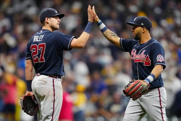 Austin Riley and Eddie Rosario of the Atlanta Braves celebrate after the Braves defeated the Milwaukee Brewers 3-0 in Game 2 at American Family Field...