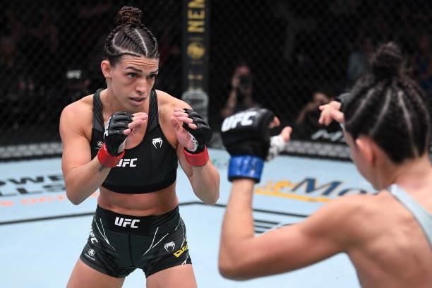 In this handout image provided by the UFC, Mackenzie Dern battles Marina Rodriguez of Brazil in their women's strawweight bout during the UFC Fight...