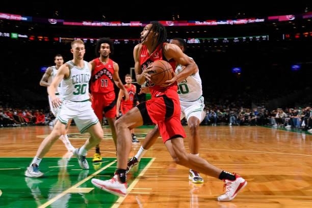 Dalano Banton of the Toronto Raptors drives to the basket during a preseason game against the Boston Celtics on October 9, 2021 at the TD Garden in...