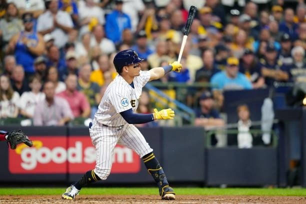 Luis Urías of the Milwaukee Brewers hits a single in the bottom of the ninth inning during Game 2 of the NLDS between the Atlanta Braves and the...