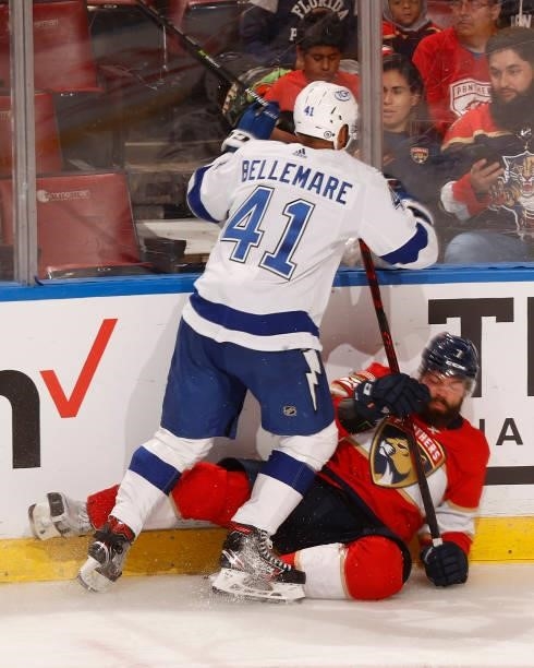 Radko Gudas of the Florida Panthers is taken to the ice by Pierre-Edouard Bellemare of the Tampa Bay Lightning during a preseason game at the FLA...
