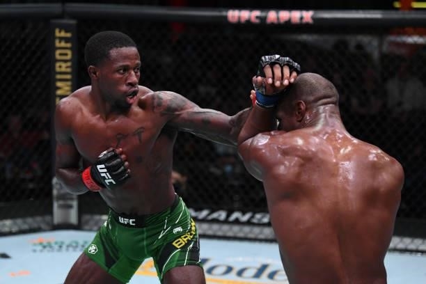 In this handout image provided by the UFC, Randy Brown of Jamaica punches Jared Gooden in their welterweight bout during the UFC Fight Night event at...