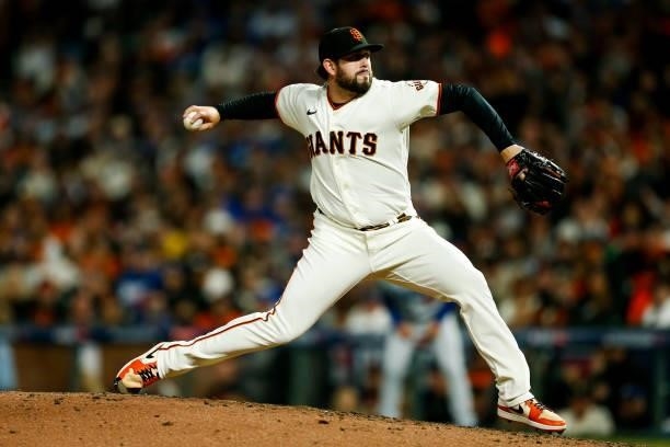 Dominic Leone of the San Francisco Giants pitches during Game 2 of the NLDS between the Los Angeles Dodgers and the San Francisco Giants at Oracle...