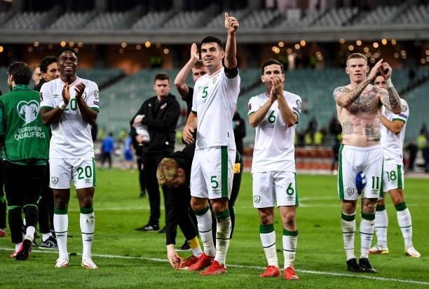 Baku , Azerbaijan - 9 October 2021; John Egan of Republic of Ireland gives a thumbs up to the travelling supporters following their victory in the...