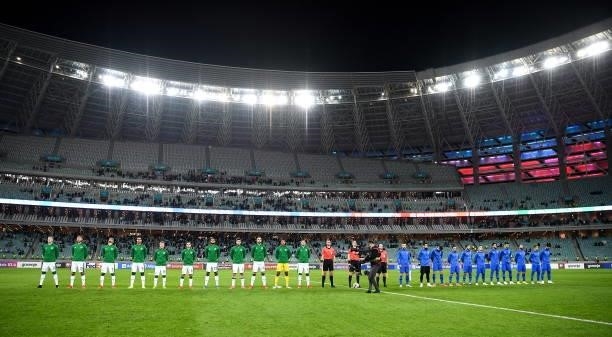 Baku , Azerbaijan - 9 October 2021; Players of Republic of Ireland and Azerbaijan line up for their national anthems before the FIFA World Cup 2022...