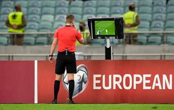 Baku , Azerbaijan - 9 October 2021; Referee Espen Eskas refers to the VAR screen during the FIFA World Cup 2022 qualifying group A match between...