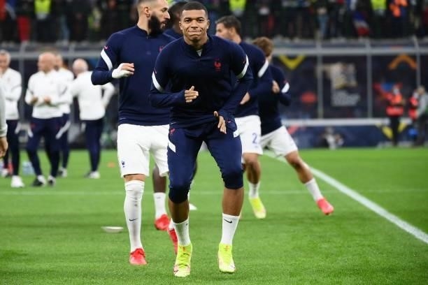 France's forward Kylian Mbappe warms up ahead of the Nations League final football match between Spain and France at San Siro stadium in Milan, on...