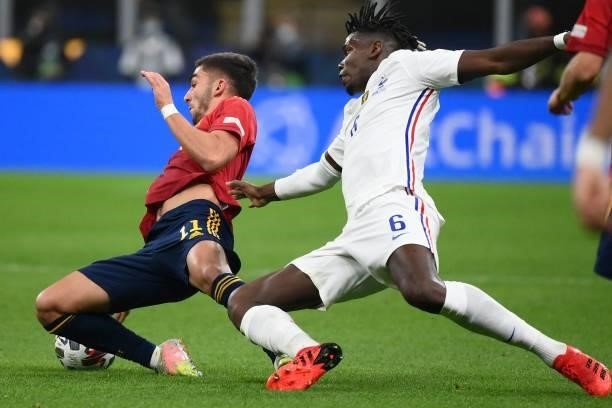 Spain's midfielder Ferran Torres vies with France's midfielder Paul Pogba during the Nations League final football match between Spain and France at...