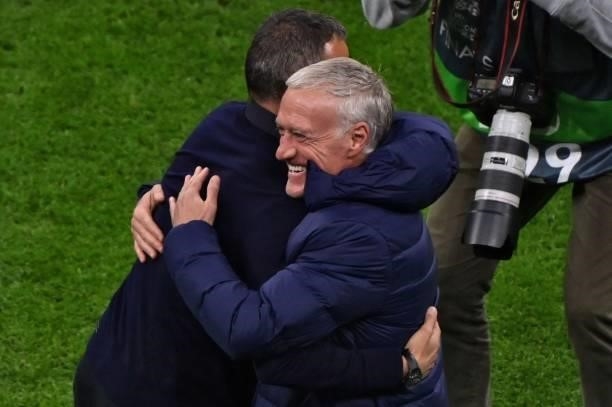 France's coach Didier Deschamps and Spain's coach Luis Enrique embrace each other ahead of the Nations League final football match between Spain and...