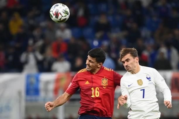 Spain's midfielder Rodri vies with France's forward Antoine Griezmann during the Nations League final football match between Spain and France at San...