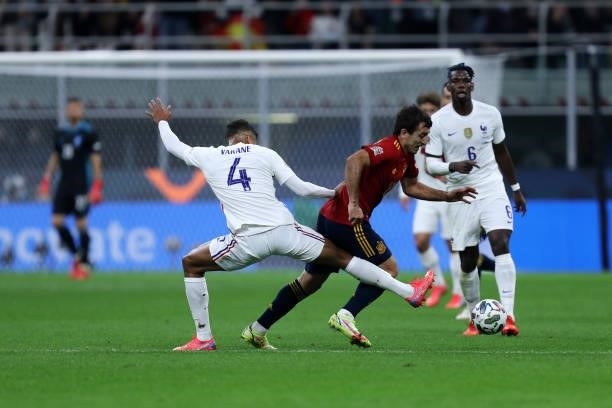 Mikel Oyarzabal of Spain and Raphael Varane of France battle for the ball during the UEFA Nations League Final match between the Spain and France at...