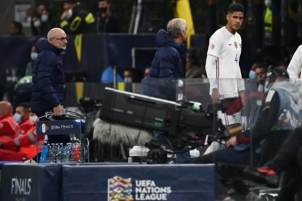 France's defender Raphael Varane leaves the pitch after getting injured during the Nations League final football match between Spain and France at...
