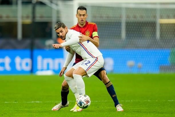 Theo Hernandez of France and Sergio Busquets of Spain battle for the ball during the UEFA Nations League Final match between the Spain and France at...