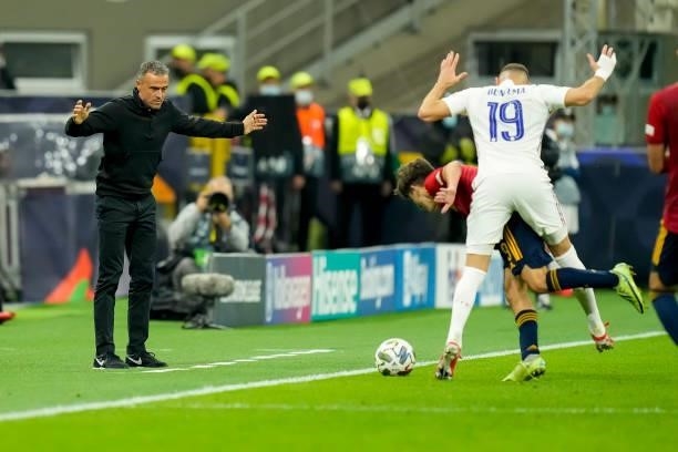 Head coach Luis Enrique of Spain, Gavi of Spain and Karim Benzema of France battle for the ball during the UEFA Nations League Final match between...
