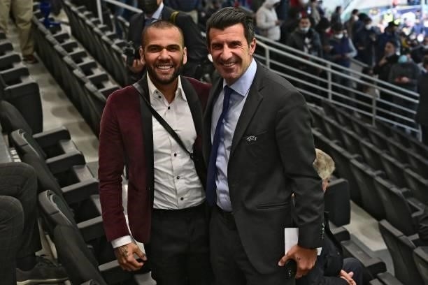 Brazilian football player Dani Alves poses with Former Portuguese football player Luis Figo during the Nations League final football match between...