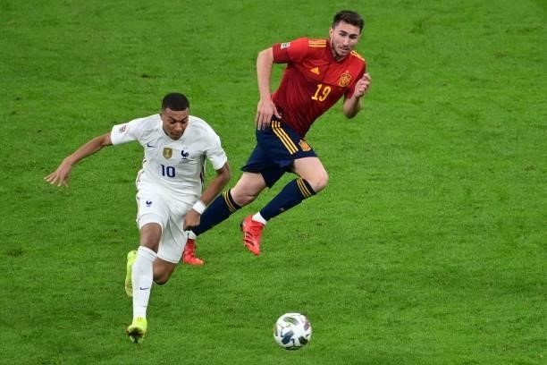France's forward Kylian Mbappe vies with Spain's defender Aymeric Laporte during the Nations League final football match between Spain and France at...