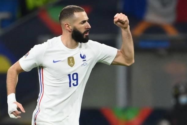France's forward Karim Benzema celebrates after scoring a goal during the Nations League final football match between Spain and France at San Siro...