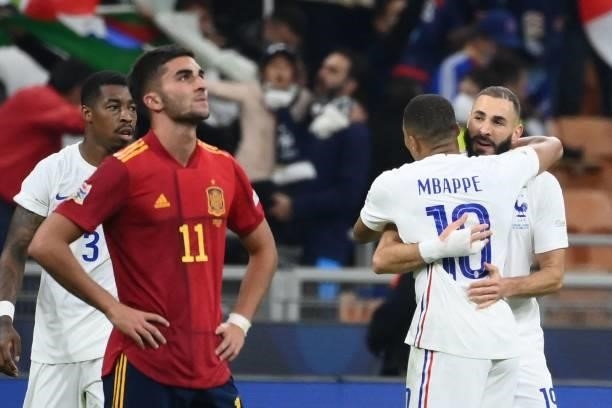 France's forward Karim Benzema celebrates with France's forward Kylian Mbappe after scoring a goal during the Nations League final football match...