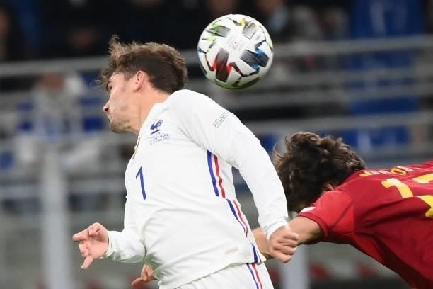 France's forward Antoine Griezmann vies with Spain's defender Marcos Alonso during the Nations League final football match between Spain and France...