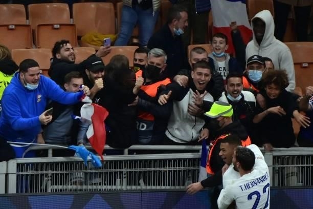 France's forward Kylian Mbappe celebrates with supporters after scoring a goal during the Nations League final football match between Spain and...