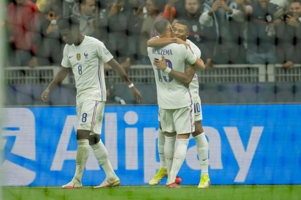 Kylian Mbappe of France celebrates after scoring his team's second goal with teammates during the UEFA Nations League Final match between the Spain...