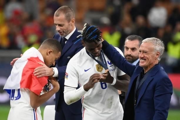 France's coach Didier Deschamps shares a laugh with France's midfielder Paul Pogba near France's forward Kylian Mbappe at the end of the Nations...