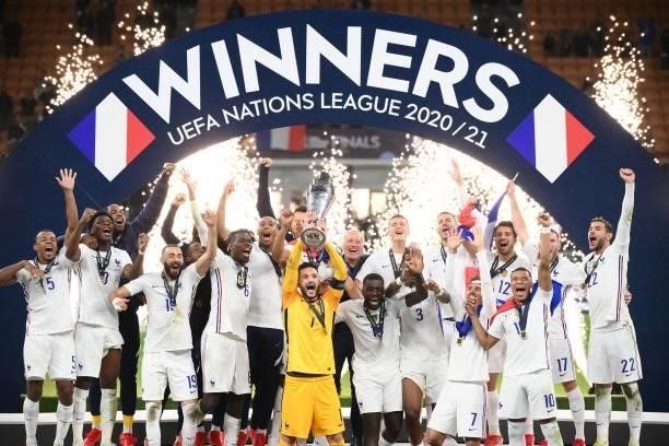 French players celebrate with the trophy at the end of the Nations League final football match between Spain and France at San Siro stadium in Milan,...