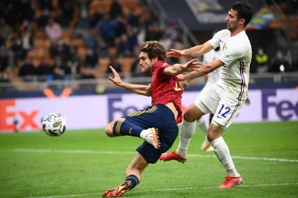 Spain's defender Marcos Alonso vies with France's defender Leo Dubois during the Nations League final football match between Spain and France at San...
