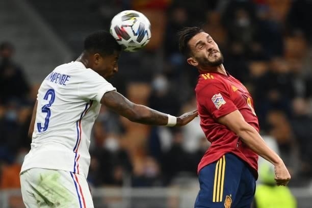 France's defender Presnel Kimpembe vies with Spain's midfielder Koke during the Nations League final football match between Spain and France at San...