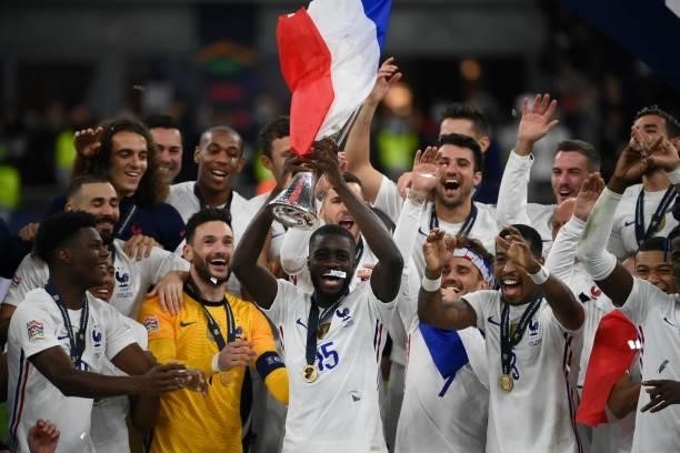 French players celebrate with the trophy at the end of the Nations League final football match between Spain and France at San Siro stadium in Milan,...