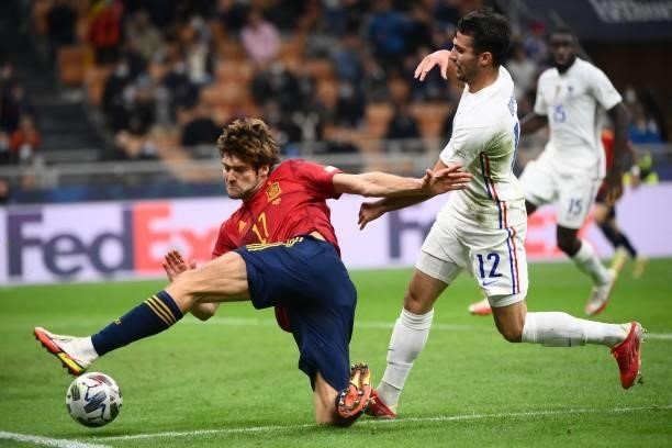 Spain's defender Marcos Alonso vies with France's defender Leo Dubois during the Nations League final football match between Spain and France at San...